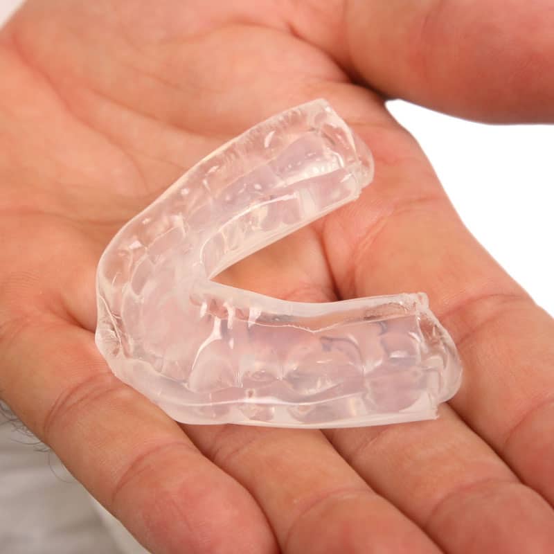 Mouth guard in hand