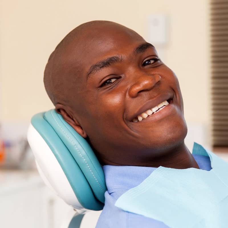 Smiling dental patient in chair