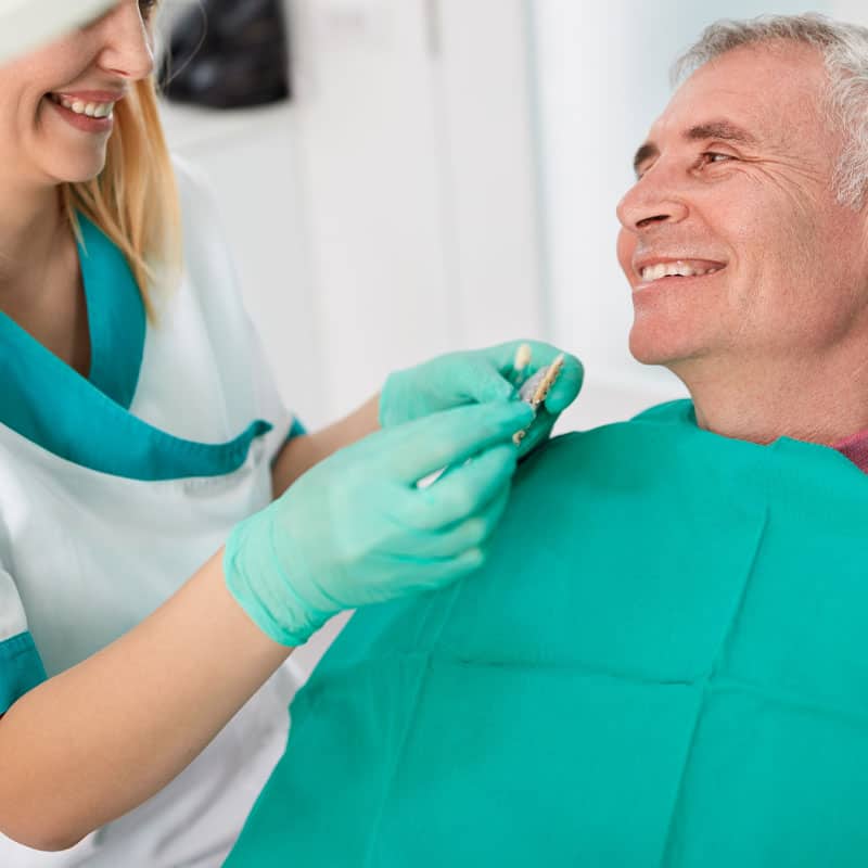 Smiling referred patient in chair